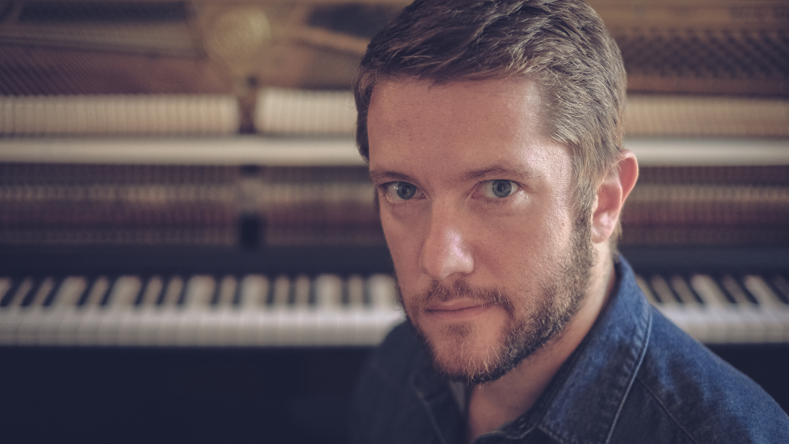 Paul Montag in front of a piano mechanism